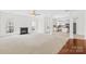 Spacious living room with a fireplace and abundant natural light at 13514 Porter Creek Rd, Charlotte, NC 28262
