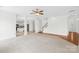 Inviting living room with stairway and view to the kitchen at 13514 Porter Creek Rd, Charlotte, NC 28262