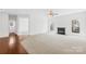 Open-concept living room with fireplace and view to entry hall at 13514 Porter Creek Rd, Charlotte, NC 28262