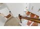 Carpeted staircase with wooden handrail in foyer of the home at 13514 Porter Creek Rd, Charlotte, NC 28262