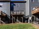 Rear view of townhomes with private wooden decks and fenced yards at 1814 Shumard Ln, Charlotte, NC 28205