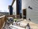 Relaxing outdoor deck with comfortable seating and view of backyard at 1814 Shumard Ln, Charlotte, NC 28205