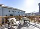 Outdoor deck with chairs and pillows for relaxation and enjoyment of a private backyard view at 1814 Shumard Ln, Charlotte, NC 28205
