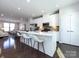 Bright kitchen with stainless steel appliances, white cabinets, and a large center island at 1814 Shumard Ln, Charlotte, NC 28205