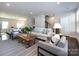 Bright living room features modern furniture, recessed lighting, and opens to the dining area, perfect for entertaining at 1814 Shumard Ln, Charlotte, NC 28205