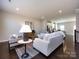 Inviting living room with hardwood floors and open layout to the kitchen at 1814 Shumard Ln, Charlotte, NC 28205