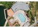An aerial view of the community pool, deck and surrounding green areas and lake at 18840 Nautical Dr # 57, Cornelius, NC 28031