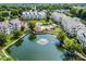 Beautiful aerial view of condominium complex with a tranquil lake and fountain at 18840 Nautical Dr # 57, Cornelius, NC 28031