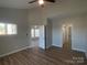 Bright bedroom with wood floors, neutral walls, high ceilings, and ample closet space, creating a comfortable and inviting atmosphere at 18840 Nautical Dr # 57, Cornelius, NC 28031