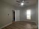 Bedroom with wood floors, a ceiling fan, a window providing natural light, and neutral paint for a tranquil atmosphere at 18840 Nautical Dr # 57, Cornelius, NC 28031