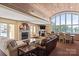 Welcoming clubhouse with stone fireplace, comfortable seating, and lake views at 18840 Nautical Dr # 57, Cornelius, NC 28031