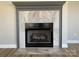 Elegant fireplace with marble tile surround and a dark gray mantel, adding warmth and charm to the living space at 18840 Nautical Dr # 57, Cornelius, NC 28031