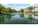 Scenic view of the neighborhood pond and reflections of the buildings at 18840 Nautical Dr # 57, Cornelius, NC 28031