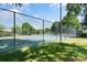 Exterior view of community tennis courts with chain link fence and surrounding trees at 18840 Nautical Dr # 57, Cornelius, NC 28031