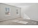 Bedroom showcasing natural light from two windows and neutral carpeting at 2108 Clapham Ct, Charlotte, NC 28215