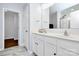 Bright bathroom with double sinks, white cabinets, and a glass-enclosed shower at 2707 Aubrey St, Monroe, NC 28110