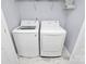 Clean laundry room featuring a modern, front load washer and dryer set at 2707 Aubrey St, Monroe, NC 28110