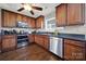 Functional kitchen with stainless steel appliances, stylish wood cabinets and dark countertops, creating a modern and efficient cooking space at 311 Glenn Allen Rd, Mooresville, NC 28115