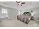 Spacious main bedroom features a tray ceiling, neutral color palette, and two windows for lots of natural light at 311 Glenn Allen Rd, Mooresville, NC 28115