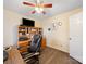 Office bedroom with a wooden desk, ceiling fan and wooden floors at 3229 Leicester Dr, Matthews, NC 28104