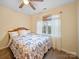 Comfortable bedroom with a patterned duvet cover and light-filtering curtains at 3229 Leicester Dr, Matthews, NC 28104