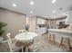 Cozy dining area with a round table, white chairs, and an open view to the kitchen at 3229 Leicester Dr, Matthews, NC 28104