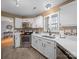 Bright kitchen featuring white countertops, stainless steel appliances, and ample cabinet space at 3229 Leicester Dr, Matthews, NC 28104