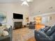 Spacious living room featuring a fireplace, entertainment center, and comfortable seating arrangement at 3229 Leicester Dr, Matthews, NC 28104