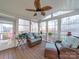 Inviting sunroom featuring wicker furniture, wooden floors, and plenty of natural light at 3229 Leicester Dr, Matthews, NC 28104