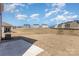 Expansive backyard view with several houses in the background, providing a sense of community and neighborhood at 3309 Colorado Blue Ct, Gastonia, NC 28056