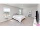 Bright bedroom with natural light, neutral carpet, and a comfortable queen-size bed, perfect for relaxation at 3309 Colorado Blue Ct, Gastonia, NC 28056