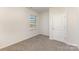 Bedroom featuring neutral carpet, natural light, and a closet, creating a comfortable living space at 3309 Colorado Blue Ct, Gastonia, NC 28056