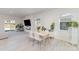 Open dining area with stylish table setting, abundant natural light, and views to the backyard at 3309 Colorado Blue Ct, Gastonia, NC 28056