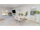 Open dining area with stylish table setting, abundant natural light, and views to the backyard at 3309 Colorado Blue Ct, Gastonia, NC 28056