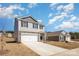 Desirable two-story home featuring a stone facade, attached garage, and green landscaping under blue skies at 3309 Colorado Blue Ct, Gastonia, NC 28056