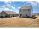 Exterior showing backyard with view of back of home and detached garage, ideal for outdoor enjoyment and extra parking at 3309 Colorado Blue Ct, Gastonia, NC 28056