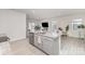 Open-concept kitchen with granite countertops, stainless steel appliances, and view to the living and dining areas at 3309 Colorado Blue Ct, Gastonia, NC 28056