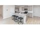 Well-lit kitchen featuring gray cabinets, granite counters, stainless appliances, and breakfast bar at 3309 Colorado Blue Ct, Gastonia, NC 28056