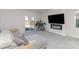 Cozy living room with gray sectional, electric fireplace, flatscreen tv, and sliding glass doors to backyard at 3309 Colorado Blue Ct, Gastonia, NC 28056