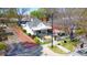 Quaint building with Brakeman's Coffee & Supply sign, surrounded by a white picket fence and lush landscaping at 4102 Harmony Hills Dr, Matthews, NC 28104