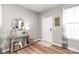 Stylish entryway features wood-look floors, a console table and a bright window at 4102 Harmony Hills Dr, Matthews, NC 28104