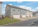 Townhomes featuring a paved driveway, attached garage and manicured lawns at 4102 Harmony Hills Dr, Matthews, NC 28104