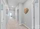 Hallway featuring carpeted floor, neutral walls, recessed lights and white doors at 4102 Harmony Hills Dr, Matthews, NC 28104