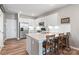 Modern kitchen featuring white cabinets, stainless appliances and lots of natural light at 4102 Harmony Hills Dr, Matthews, NC 28104