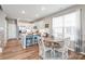 Eat-in kitchen area offers white cabinets, stainless appliances and lots of natural light at 4102 Harmony Hills Dr, Matthews, NC 28104