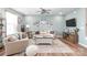 Bright living room with stylish decor, hardwood floors and large windows at 4102 Harmony Hills Dr, Matthews, NC 28104