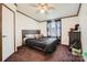 Comfortable bedroom featuring plush carpet, a built-in closet, and a ceiling fan at 4285 Dc Dr, Concord, NC 28025