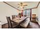 Dining room with a ceiling fan, large table, bench seating, and natural light from the window at 4285 Dc Dr, Concord, NC 28025