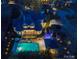 Aerial view of a luxurious estate with a pool, spa, manicured grounds, and outdoor living spaces at 4510 Old Course Dr, Charlotte, NC 28277