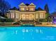 Stunning backyard featuring a luxurious pool, spa, and elegant outdoor entertaining space at 4510 Old Course Dr, Charlotte, NC 28277